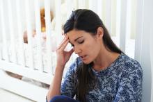 Frustrated mother suffering from postpartum depression
